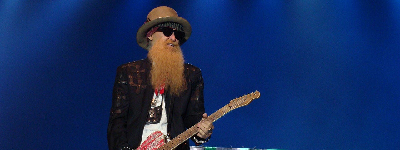 Billy Gibbons of ZZ Top playing guitar.