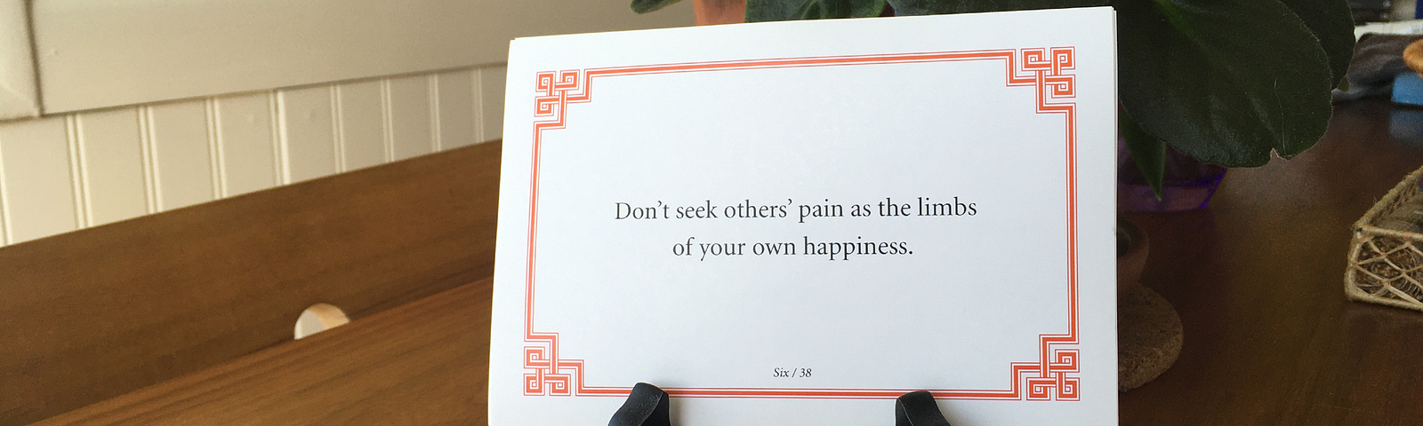 Lojong slogan card reading “Don’t seek others’ pain as the limbs of your own happiness.”