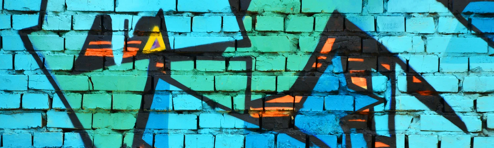 Turquoise on brick wall — mural on street art