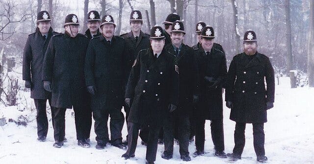 Group of British Police officers in snowy weather