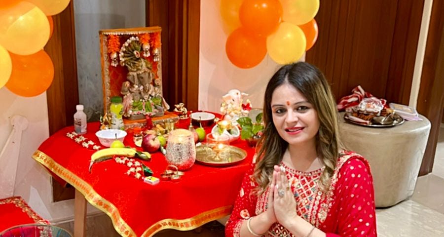 Woman praying to Lord Ganesha