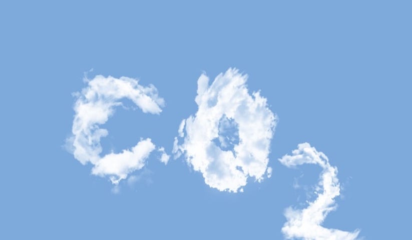 IMAGE: The characters CO2 written in the sky with the fumes of a plane