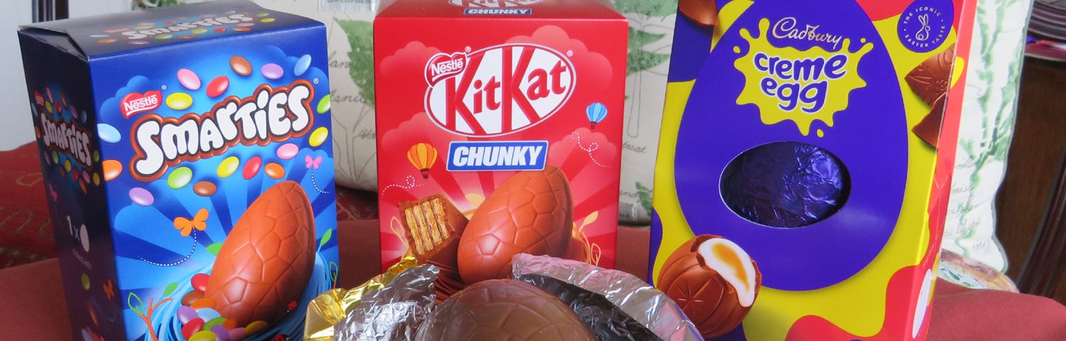 A group of three boxed Easter Eggs and one ‘nesting’ in its gold foil.