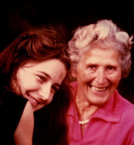 An older woman and a younger woman smiling for the camera