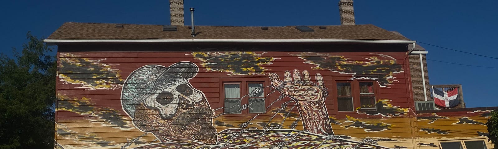 A mural from Pilsen shows a depiction of the artist in his own mural