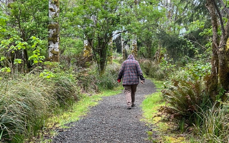 My wife is on an accessible trail to an Oregon beach after hip replacement.