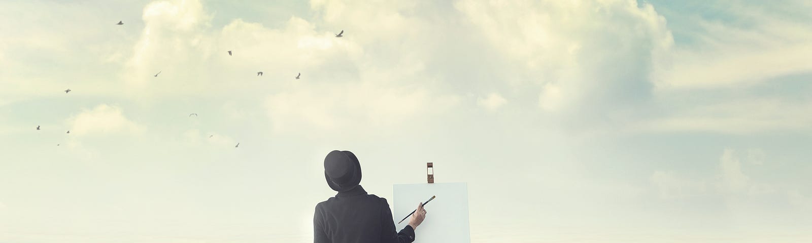 A man standing in the ocean with an easel and a paintbrush.