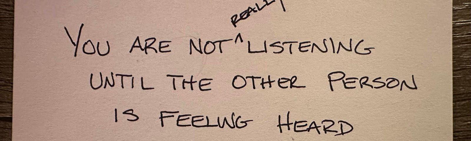 Note card with a quote about listening, “You are not really listening until the other person is feeling heard.” — Simon Sinek