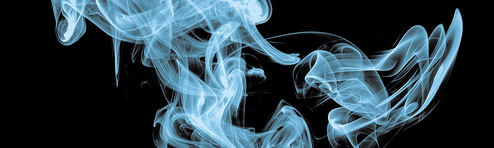 Curls of white cigarette smoke against a black background