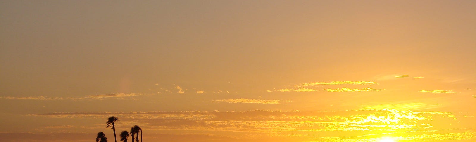 a gorgeous sunset with silhouettes of islands in the ocean. Life’s suffering