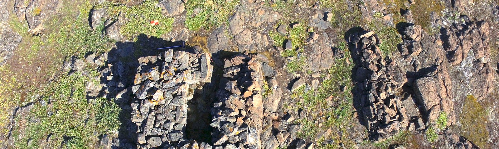 A drone picture of a Norse ruin constructed of stones