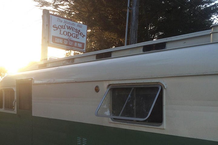 A vintage trailer at dusk.