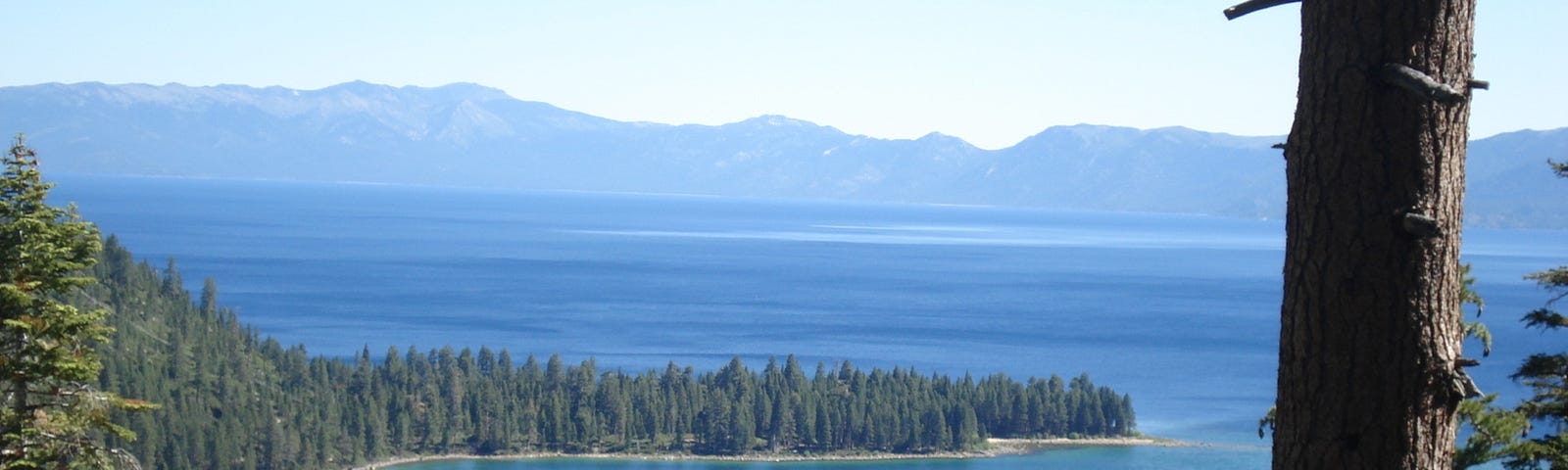 Emerald Bay at Lake Tahoe, blue water against pine trees