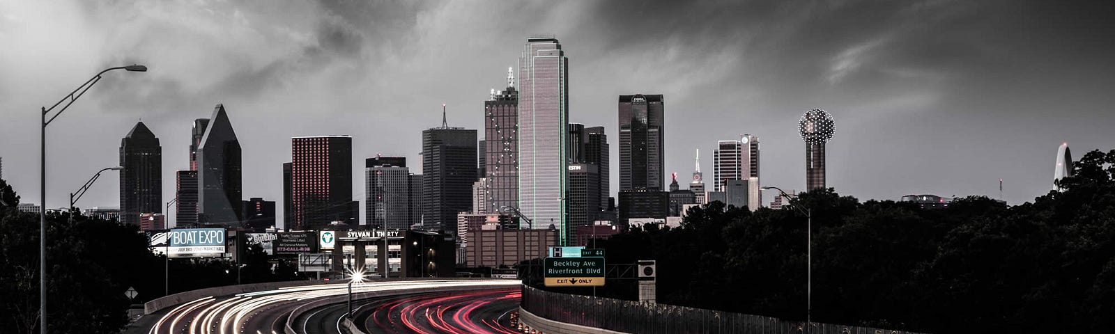 Time lapse of rush hour traffic on I-30 coming out of Downtown Dallas, Texas at night