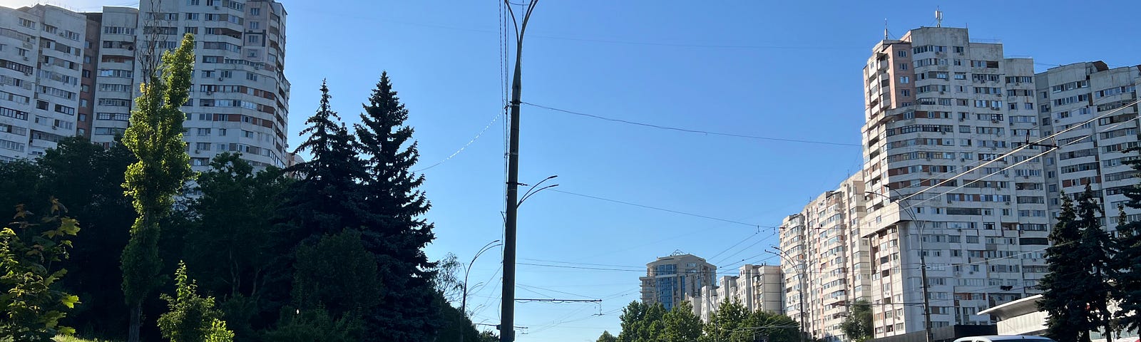 Tall buildings on either side of a street.