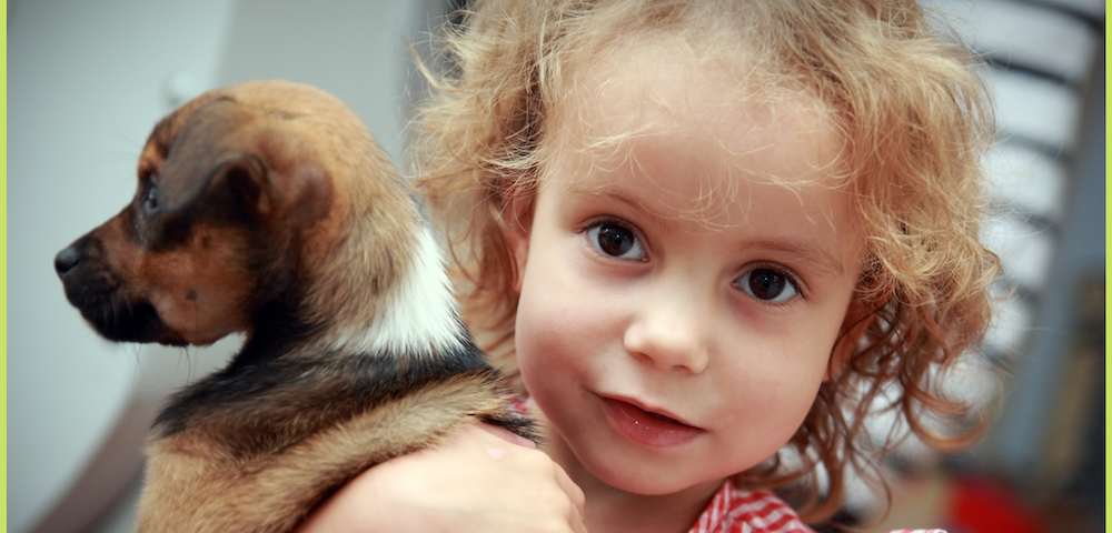 picture of a little girl and her puppy