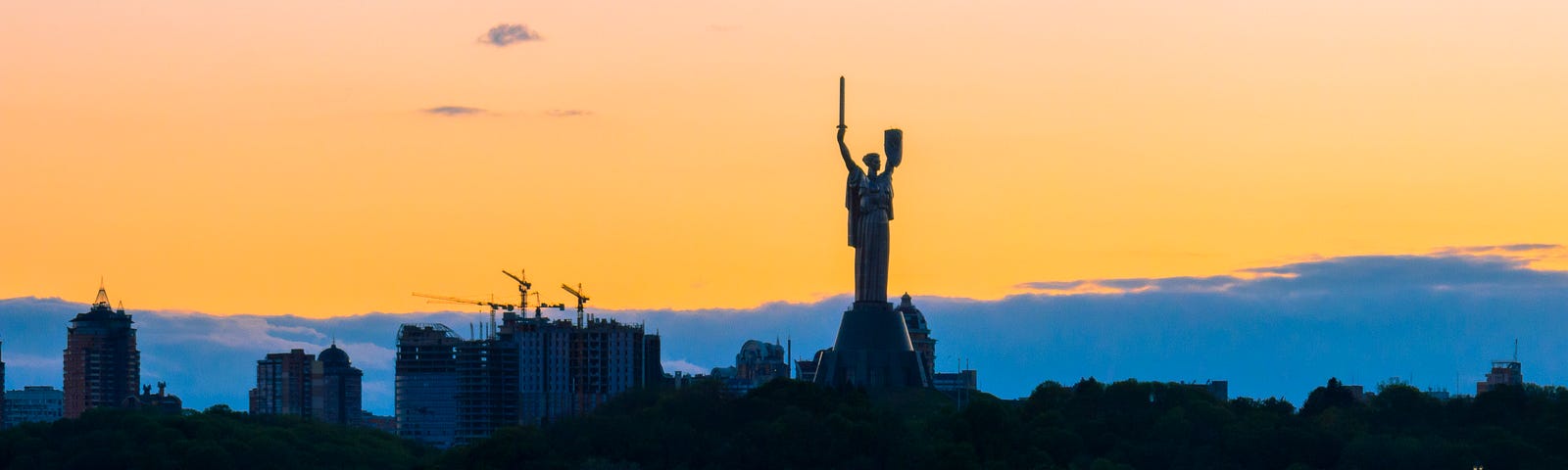 The monument called Mother Ukraine stands watch over the skyline of Kyiv, Ukraine. Photo by Artem Hvozdkov/Getty Images