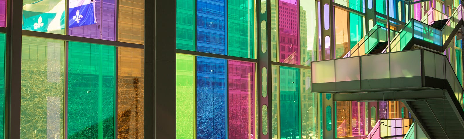 A staircase in front of the colourful windows at the Palais de Congrès in Montreal, Canada, where CHI 2006 and CHI 2018 were held. Image credit: Société du Palais des congrès de Montréal Royalty Free Photos.