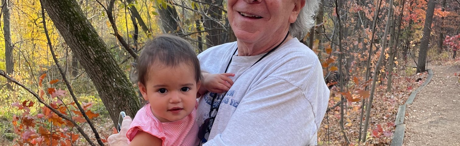 Bob and our grands enjoying the park on a warm spring day.