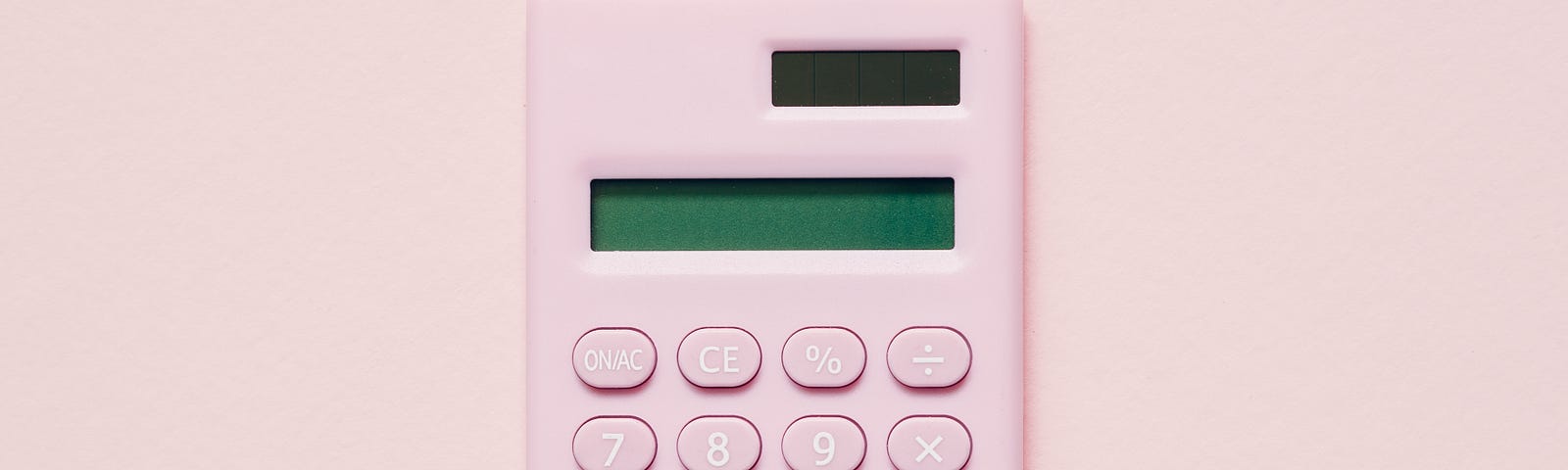 Image shows a pink calculator with a blank screen.