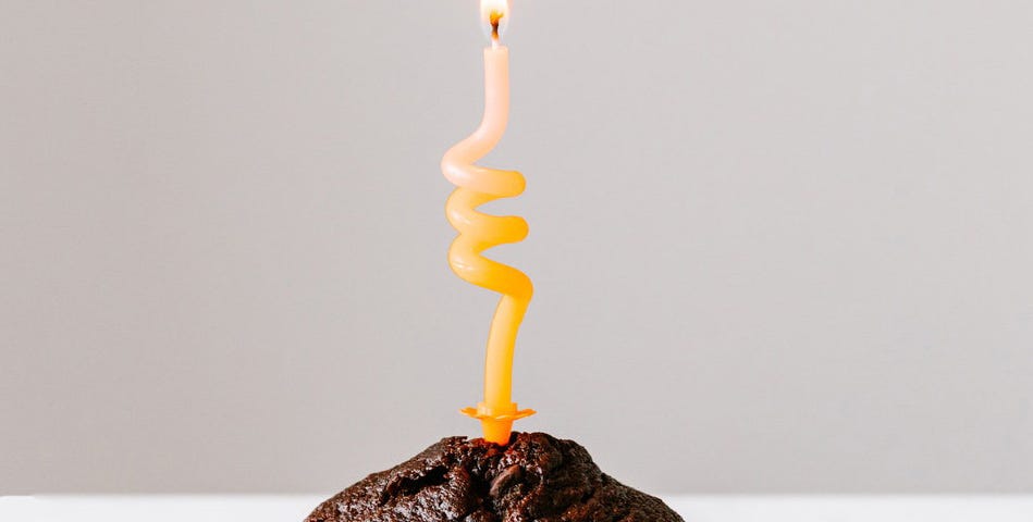 Cupcake with candle in a corkscrew shape