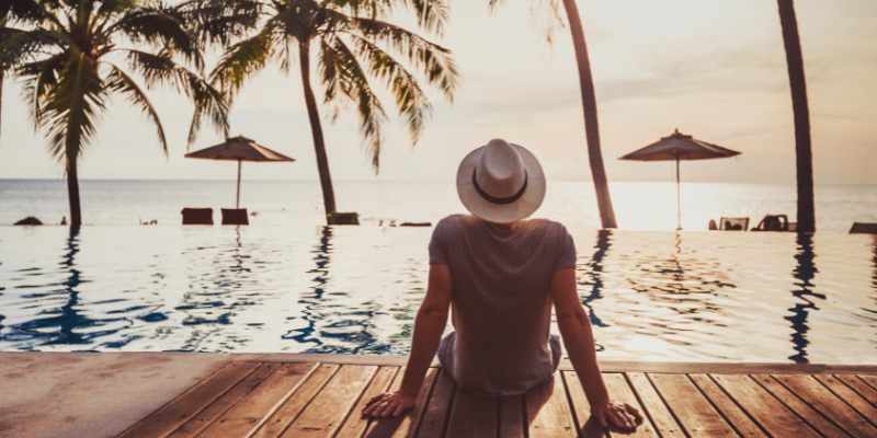 Man with hat at beach — The System I Use To Smash My Goals and Create My Dream Life