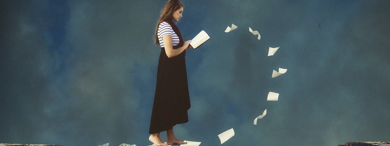 A woman reading a magical book.