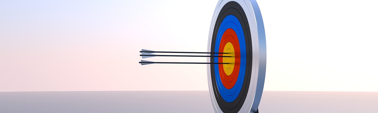 Several arrows stuck in the bullseye position of a target