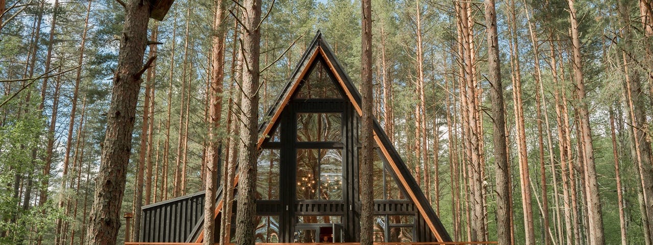 A beautiful cabin in the middle of the woods.