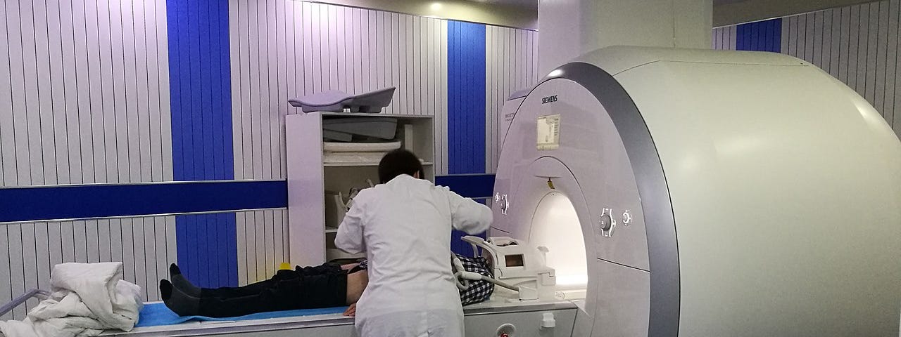 A photograph of a patient in an Siemens MRI scanner