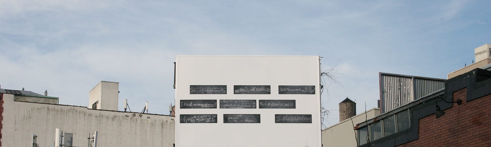 A billboard with blank spaces meant for community members to fill in together; a project by Gary Simmons