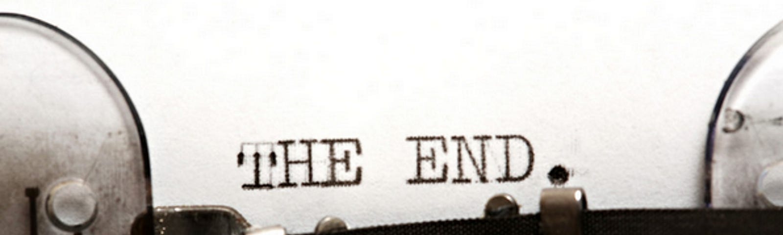 Photo of typewriter with the end — text on page