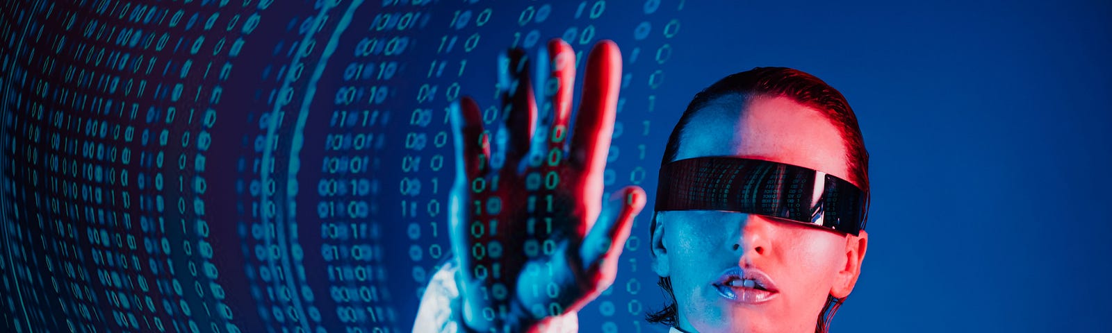 A woman wearing futuristic goggles and reaching out, moving floating binary code with her hand.