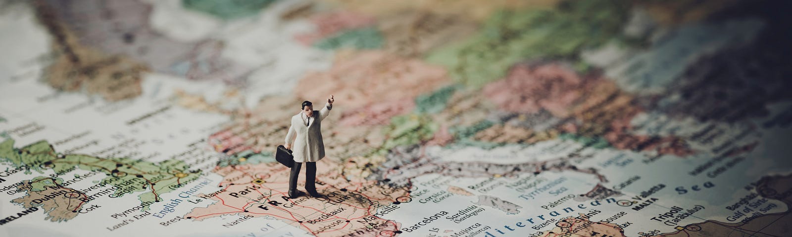 Image of figurine man placed on a map