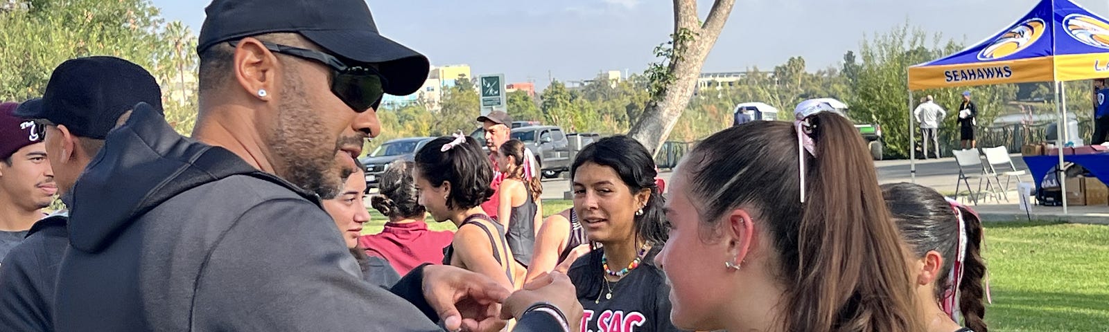 My daughter talks to her coach after a recent race.