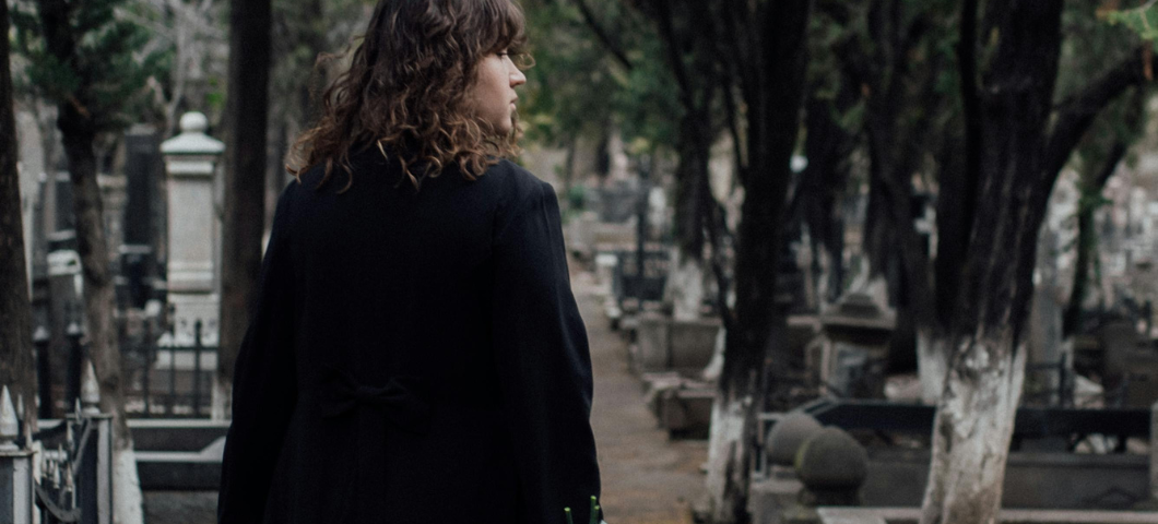 woman standing in cemetery