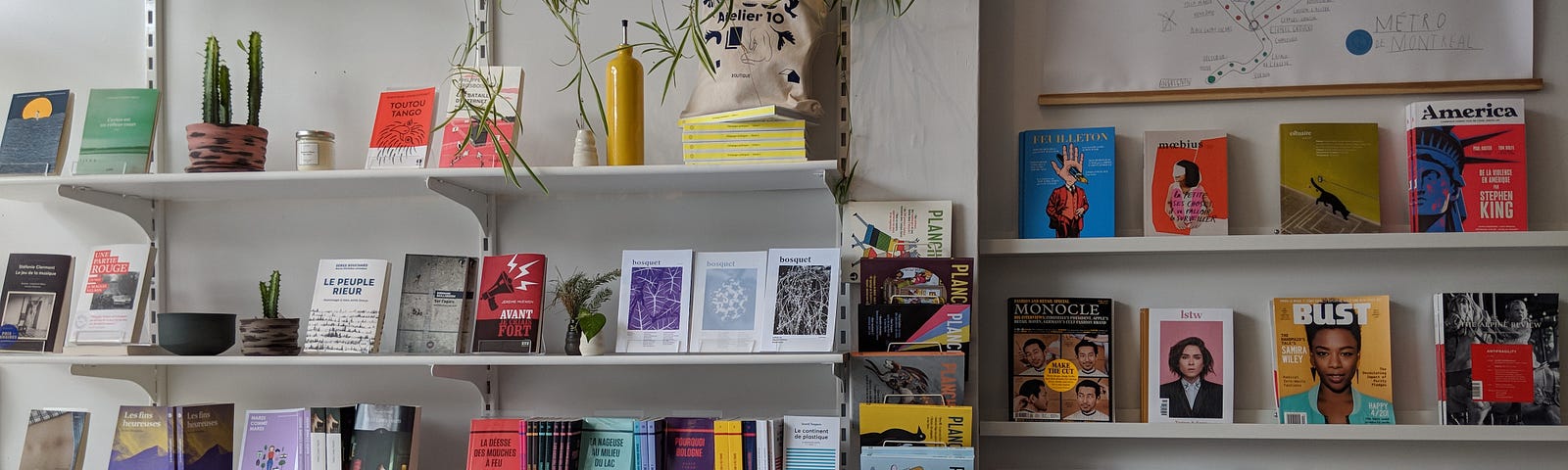 Shelves of books, magazines, and stationary displayed in a bookshop in Montreal.