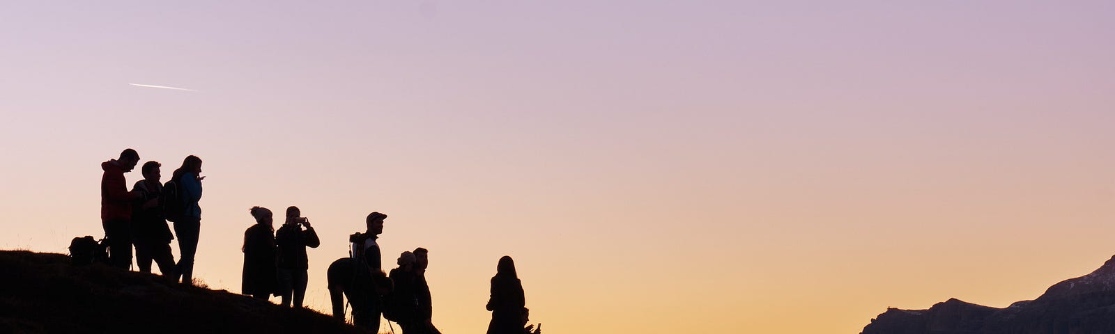 An image with people in the sunset