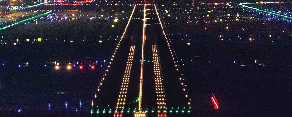 Photo of airport at night.