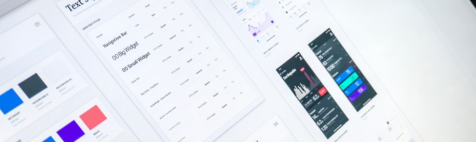 Angled close-up of a UX designer’s computer screen showing design system in use.