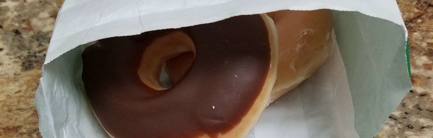 Two donuts in a Krispy Kreme bag