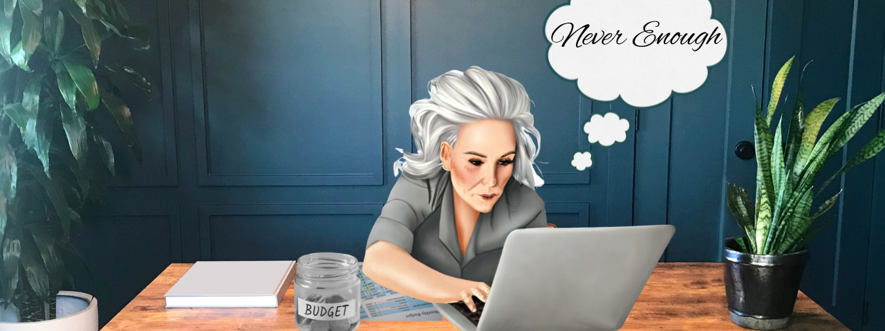 white haired women at desk in front of laptop