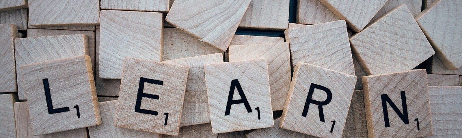Image of Scrabble tiles that spell the word “learn”.