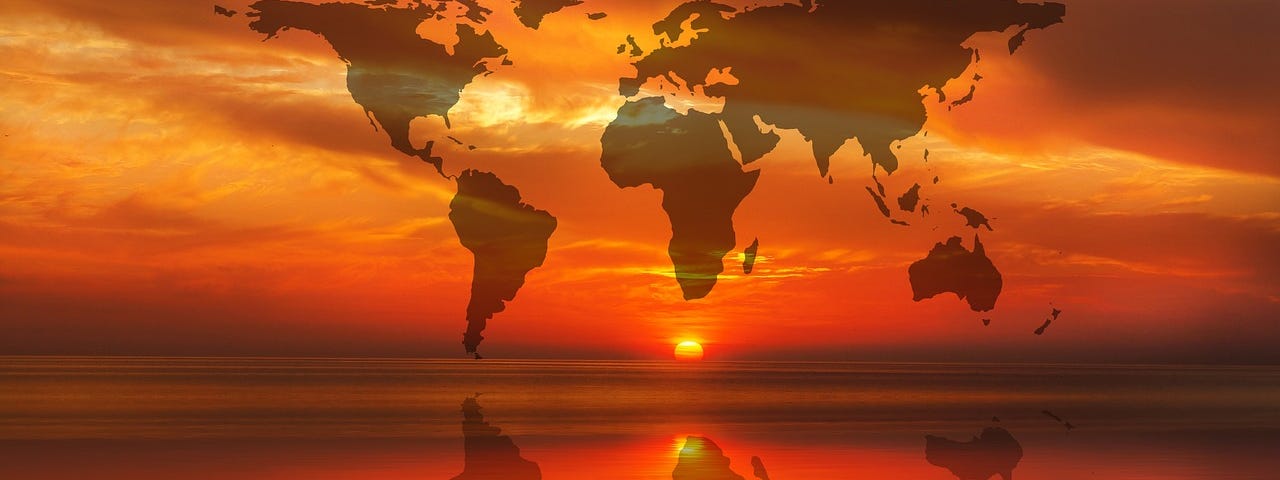 Image of a bright red and orange sunset over the water, with the continents of earth in the sky and reflected in the water.