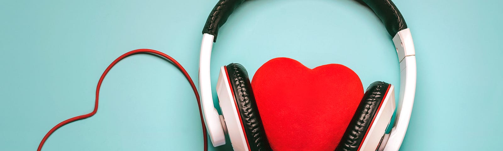 A heart with headphones around it (relationships, music, lyrics, attachment styles)