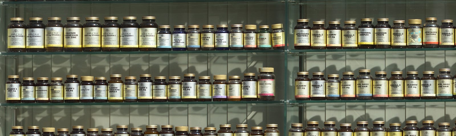 many bottles of pills on display