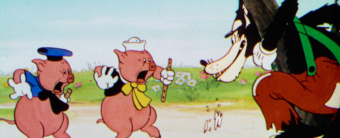 Disney’s Three Little Pigs movie still, featuring two pigs and the wolf.