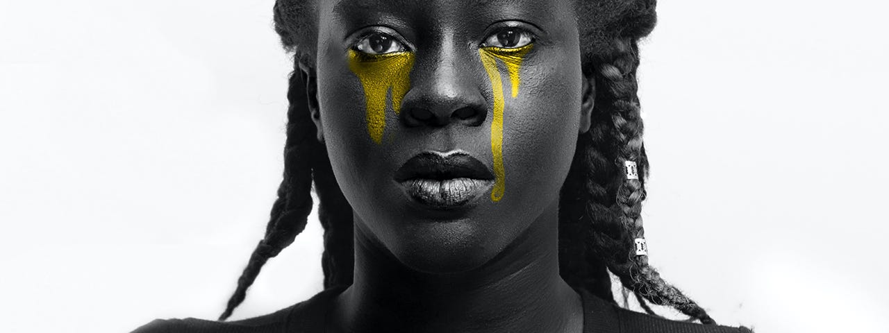 Grayscale photography of a black woman with yellow tears.