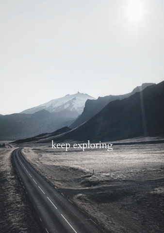 Highway leading into the mountains, with the words “keep exploring” superimposed