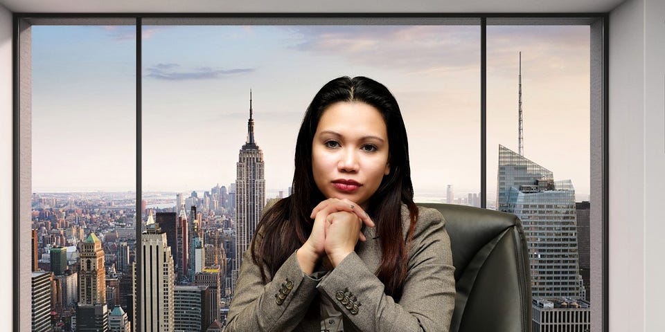 Businesswoman in boardroom with city skyline in background